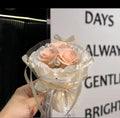 A bouquet of 3 flowers. A flower bag. A greeting card.